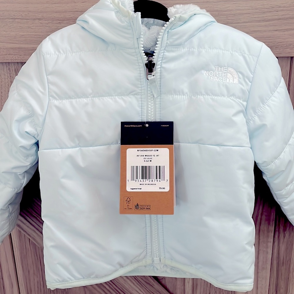 North Face VGUC size 6-12 month ice blue winter hooded jacket.